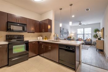 spacious open-concept kitchen and living area at The Core apartments